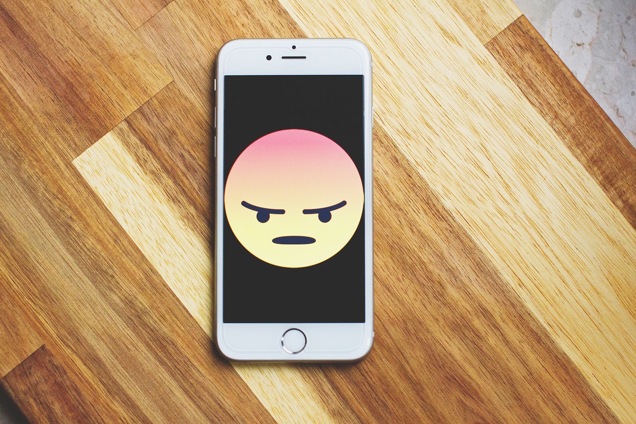 angry emoji on phone - acupuncture for anger management